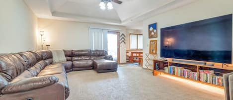 Livingroom with huge sectional and 86inch QLED TV!