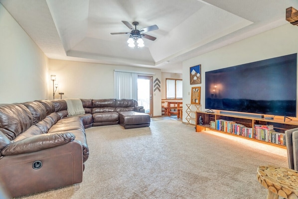 Livingroom with huge sectional and 86inch QLED TV!