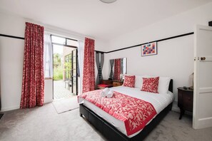 Bright fabrics and garden views create a vibrant escape for your Portsmouth adventure!