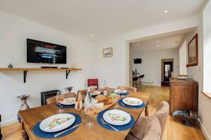 Dining Room: Gather around the vibrant table for laughter, meals, and movie nights with Netflix!