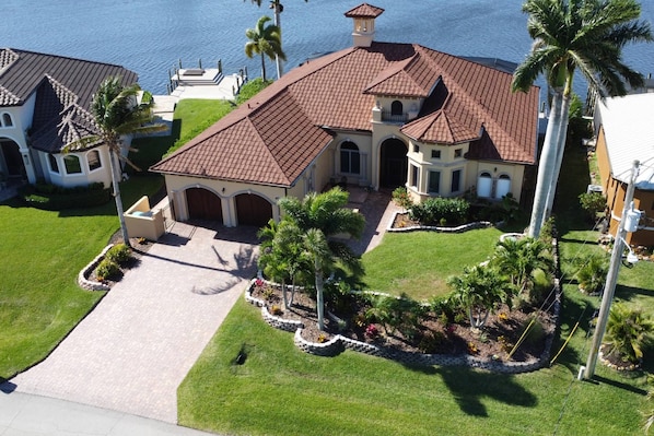 The distinctive Mediterranean flair of this stunning waterfront home, Villa Lorelei, is evident the minute you catch a glimpse it.