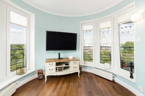 The living room's sleek design is both functional and aesthetically pleasing.