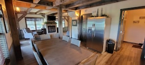 Dining Area with modern refrigerator and Dining Table, seats 6.