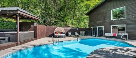 Our backyard space is a great place to make memories! It features an in-ground pool (seasonal), hot tub, sun chairs, picnic table, couch, pool safety gate, pool toys, putting green, and string lights. All fenced in for added privacy.