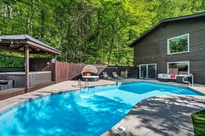 Our backyard space is a great place to make memories! It features an in-ground pool (seasonal), hot tub, sun chairs, picnic table, couch, pool safety gate, pool toys, putting green, and string lights. All fenced in for added privacy.