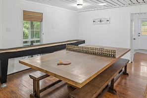 Dining room table transforms into a ping pong table with a removable custom net