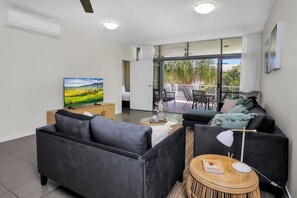 Discover comfort in our chic, modern living room, featuring a spacious and stylish design. Perfectly located just steps away from local attractions and dining, it’s an ideal spot to relax and unwind. Enjoy your favorite shows on the Smart TV, with complim