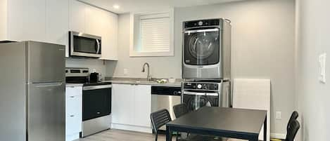 Kitchen and Dining Area, with Laundry (washer and dryer).