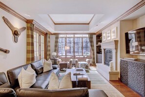 Spacious living room features a sleeper sofa.