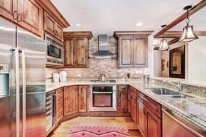 Gourmet kitchen filled with premium stainless steel appliances.