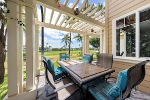 Outside dining table with golf course views