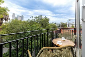Wake up to stunning city views from your private balcony.