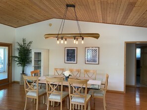 Spacious dining area for 8 with model canoe custom light. 