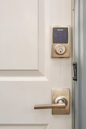 An electronic touchpad-operated smart lock permits self-check-in.