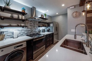 Kitchen equipped with small washer and dryer