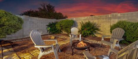 Private, fenced-in backyard for relaxing by the fire pit