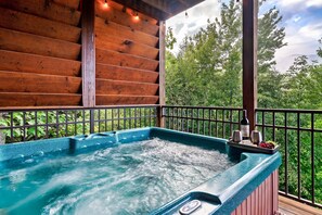 Wind down by hopping into the hot tub on the incredibly private lower patio