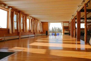 The gathering floor of the Retreat Barn is the perfect place for yoga practice, group meditation or even a dance party. This area includes a Bluetooth enabled sound system, dining room, and assorted yoga equipment.