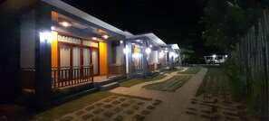 Well lit Cabanas at night.