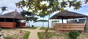 Bahay Kubo Huts adjacent to seawall facing Takbo Beach
