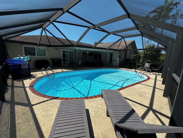 Screened in lanai, with heated pool, entertaining area with a view to the water!