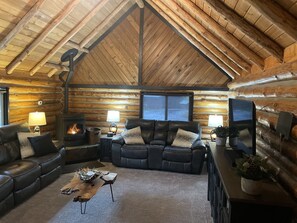 Main Living area w/checkers table, fireplace, and power reclining furniture.