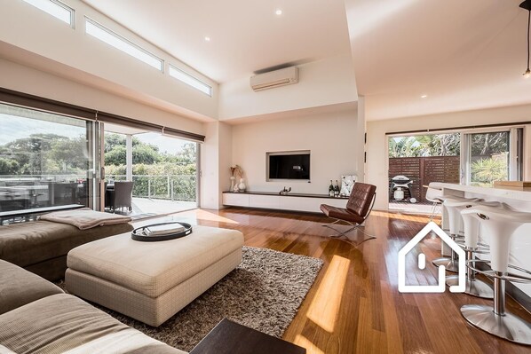 Upstairs open plan living opening to the wraparound deck