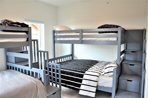 Third bedroom with 2 sets of single over double staircase bunks