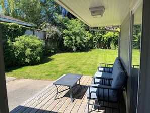 Fully fenced back yard with deck and bbq.