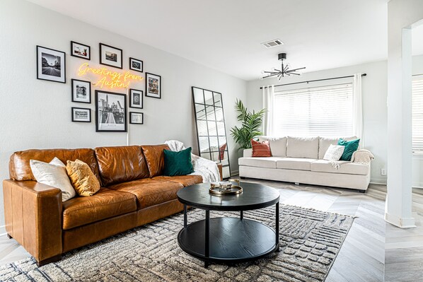 Living room with plenty of seating and sofa bed.