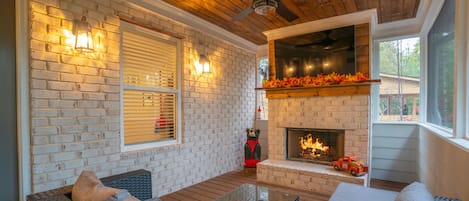Enjoy a screened in movie night with wood burning fireplace!