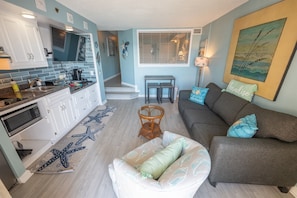 - Relax in a bright, beachy living space with coastal décor & comfortable seating - Open layout offers a cozy spot to unwind, fully equipped kitchen for easy meals - Just steps from the shore, this inviting retreat is perfect for your Myrtle Beach escape