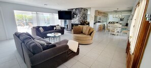Living Room with fireplace and 60" inch Tv