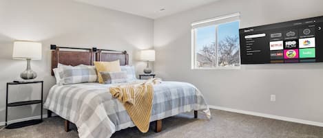 Master bedroom features a Massive king bed and smart TV.