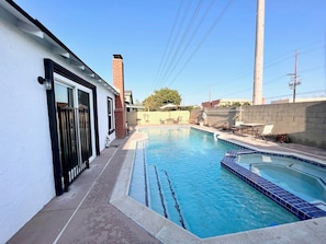 Long steps in pool to allow for shallow water play. Sliding door has alarm