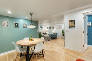 Gather 'round our dining table for delicious meals, puzzle marathons, or a bit of internet surfing – all with a side of vibrant art!