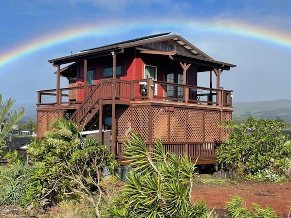 Aloha & Welcome! Come enjoy our two-story, off-grid house, with epic Volcano - Ocean - Lava Views! Come relax on the wraparound lanai (porch) and enjoy a cool breeze a stunning sunrise and sunset! And Rainbows Galore! :)