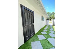 Walkway to front door of rental. Park next to guest house, walk through gate