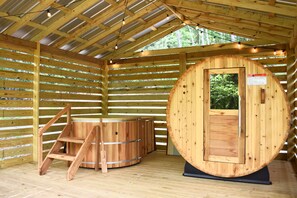 Cedar barrel sauna & Japanese soaking tub in covered deck. 