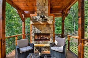 Come relax by the outdoor fireplace 