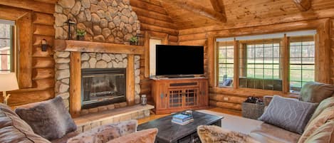 Main Living Area, 65" Smart TV and Wood burning Fireplace