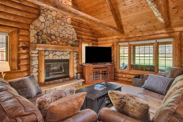 Main Living Area, 65" Smart TV and Wood burning Fireplace