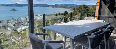 Outdoor undercover Dining area with spectacular views and heater.