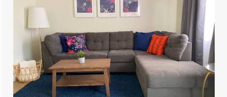 Living room with comfy sofa and the perfect pops of color