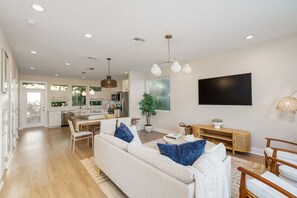 Open concept kitchen, dining and living area