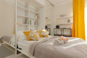 The cosy bedroom features a luxurious double bed and ample storage.