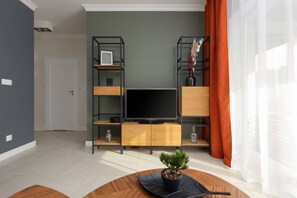 Relax in the stylish living room with a comfortable sofa and modern decor.