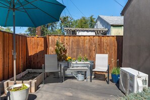 Private patio with umbrella for shade