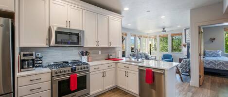 Upgraded kitchen with new stainless steel appliances and cabinetry