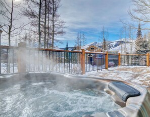 Relax after a long day on the slopes in the private hot tub, conveniently located  on the wrap-around deck
